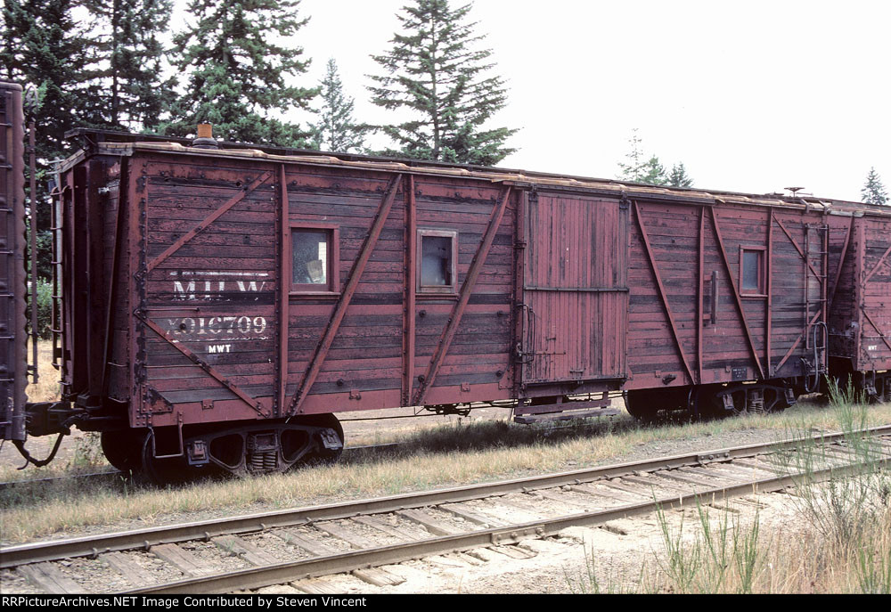 Milwaukee Road X916709 in bridge gang work train.