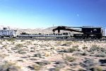 Union Pacific #910005 a 250 ton derrick here with boom car 909334, caboose 903225.