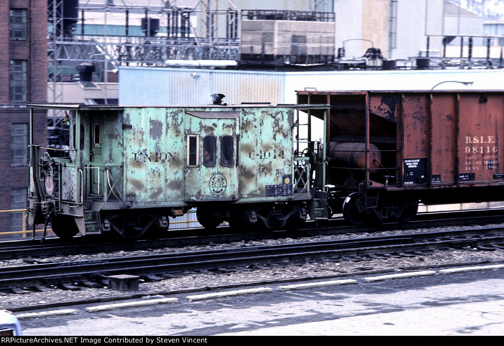 Union RR caboose C-1014 on rear of coal train.