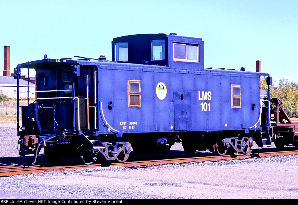 Logistics Management Services caboose #101 in ex BAR yard with pig cars.