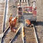 CN MOW adjusting a frog by heating rail