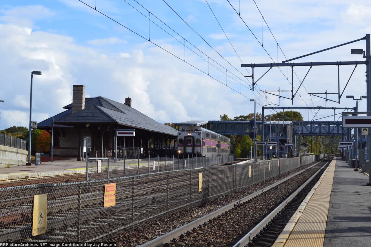 An inbound coming off the Stoughton Branch comes by the old depot