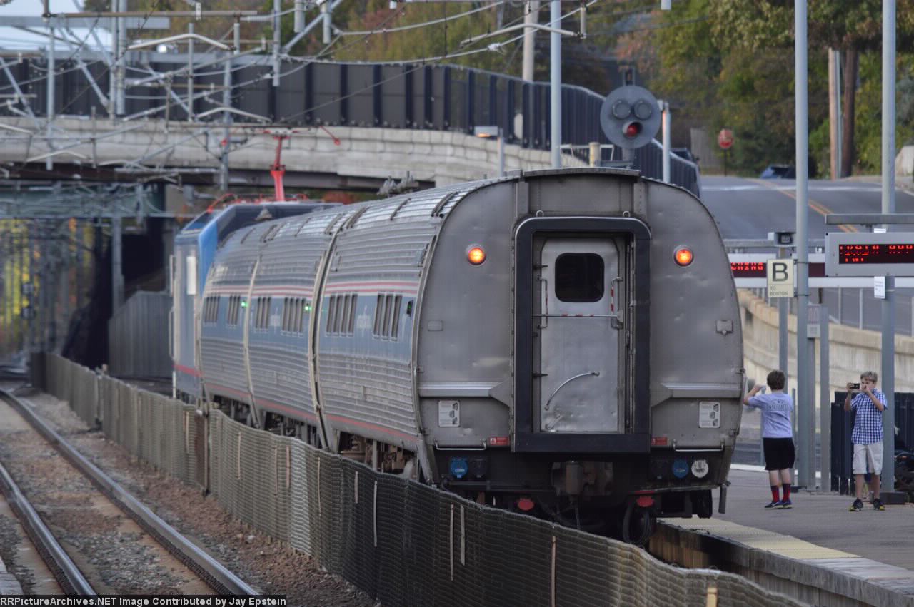 A three car ACS-64 test train heads off towards Boston