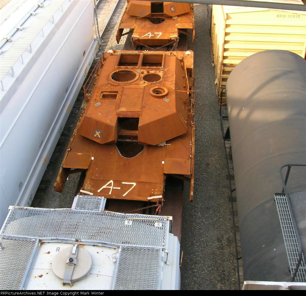 Army tanks on DODX flat cars in the yard