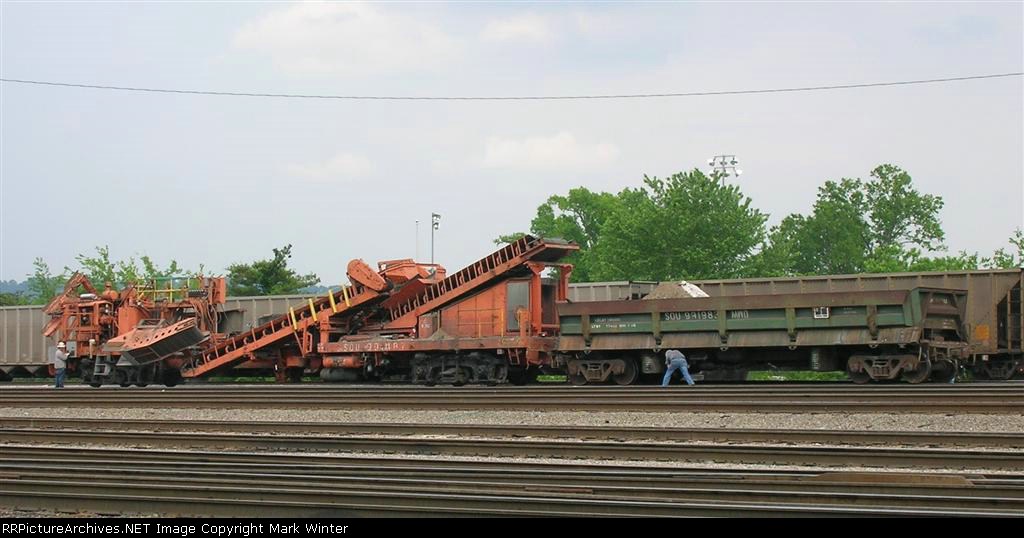 SOU 991983 behind the ballast cleaner, in the yard,