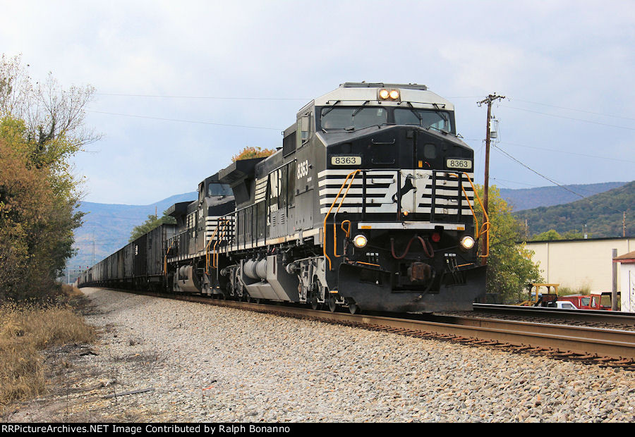An eastbound manifest led by an ex Conrail GE rolls past as it approaches Roanoke