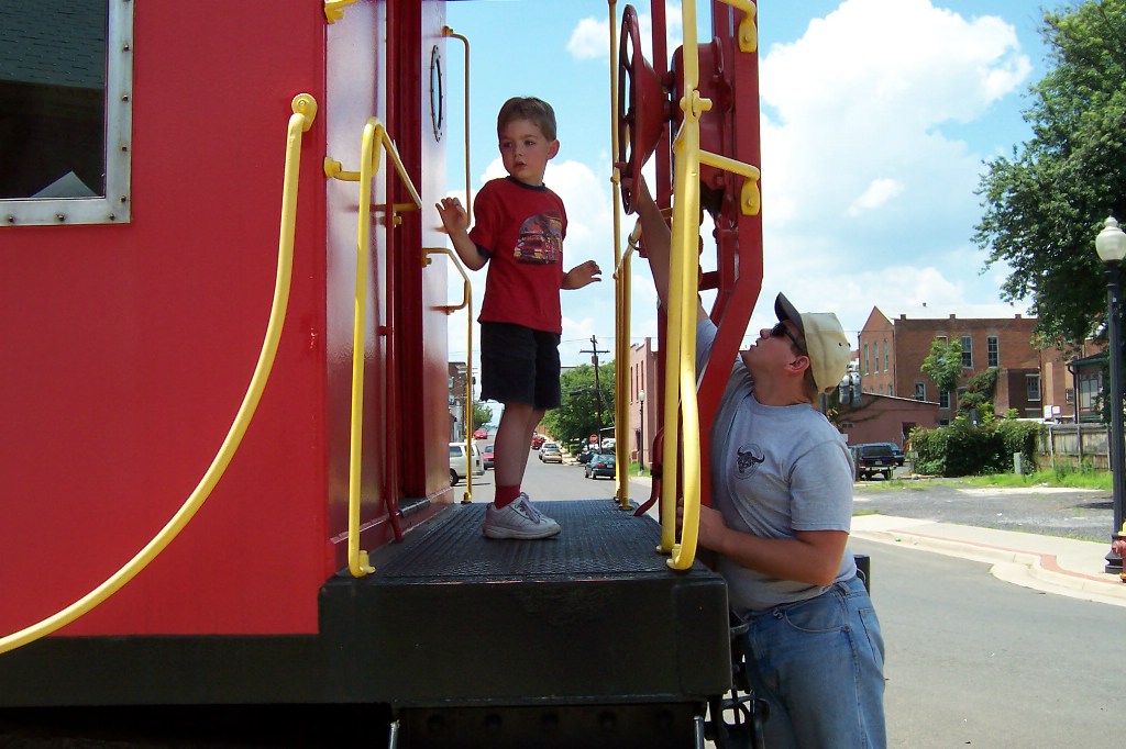 I show my little railroader how the hand brake is used, but he wants to explore rather than learn