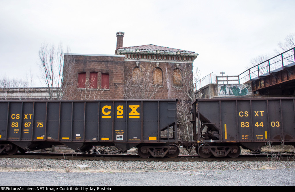 Empty coal hoppers drift south past former Union Station