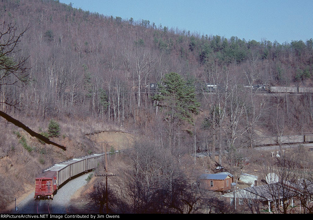 A westbound empty coal train snakes its way up the loops.