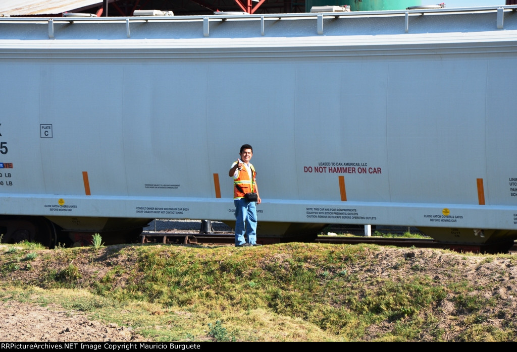 Ricardo taking pictures on the yard