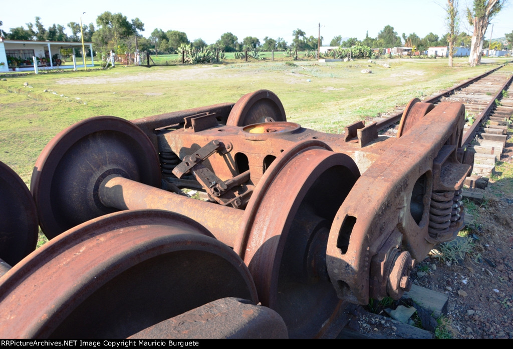 Old trucks laying on the tracks