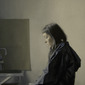 Girl reading a letter at an open window