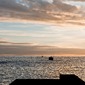 boat on the ocean at sunset 