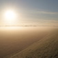 Morning sun rises over the River Trent bund