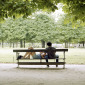 Young woman resting her head on young man's lap