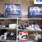 Thrift store TVs with kissing men