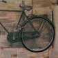 A step behind, one. Bicycle.