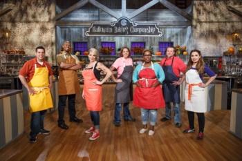 Contestants, from left, Brad Rudd, Damien Bagley, Amy Strickland, Michelle Antonishek Tamara Brown, John Schopp, and Veronica von Borstel pose for a portrait, as seen on Food Network's Halloween Baking Championship, Season 2.