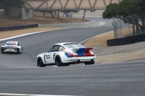 Porsche RSR 3.0 chasesPorsche 935 J down the Corkscrew