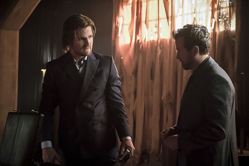 Arrow -- "So It Begins" -- Image AR506a_0079b.jpg -- Pictured (L-R): Stephen Amell as Oliver Queen and Art Kitching as Volkov -- Photo: Katie Yu/The CW -- é 2016 The CW Network, LLC. All Rights Reserved.