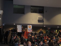 Students with F-Train Sign at MTA Hearing