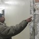 Benay Chisholm Shows Cracks in Her Building's Walls(Jon Schuppe/DNAinfo)