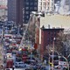 Chinatown Residents Return To Last Year's Fire-Ravaged Tenement(AP/Peter Morgan)
