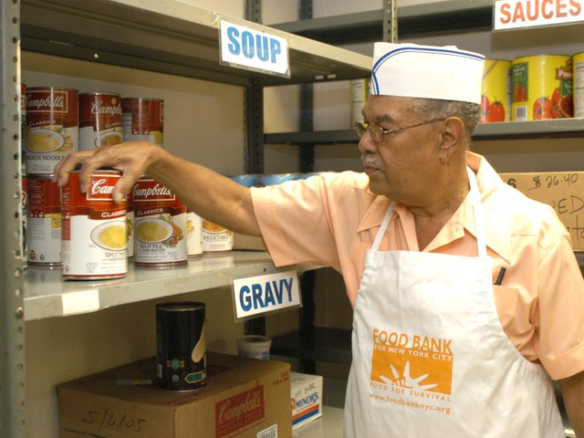 Food Bank Worker Stocking the Shelves