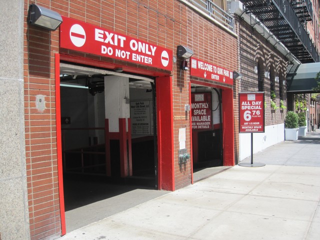 Quik Park, located across the street from where St. Vincent's Hospital had been, has downsized and now attempts to lure customers with specials to keep business alive.