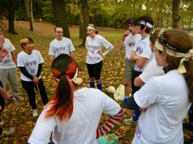 Quidditch players discuss strategy before the game.