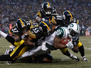 Jets WR Santonio Holmes celebrates his team's 22-17 win over the Steelers. Holmes played his first four seasons with Pittsburgh before being traded to New York in the spring.