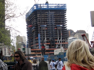 A flag bearing the names of 9/11 victims hangs on a fence across from Ground Zero.
