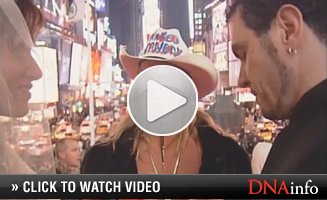 The Naked Cowboy performs in Times Square.