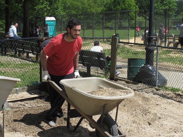 Amin Benmesbah, owner of Furry Fiends pet store on 207th Street in Inwood. Benmesbah donated doughnuts and coffee for the workers, treats for the dogs and muscle for the clean up.