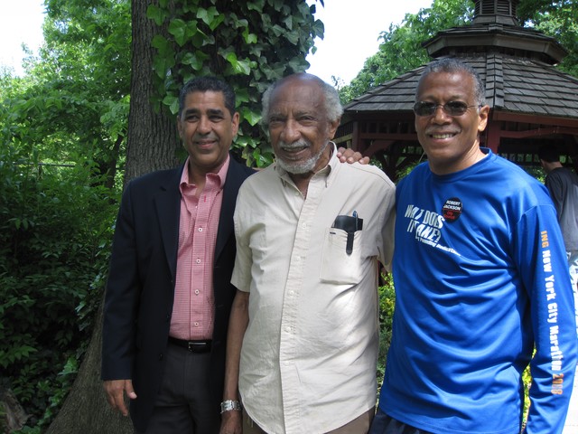 Assemblyman Adriano Espaillat visited with volunteers and thanked Jack Reynolds, father of Bruce Reynolds, a Port Authority Police Officer who had tended to the garden and the area throughout his life. Bruce Reynolds died on September 11th. Robert Jackson stands with the pair in the garden.
