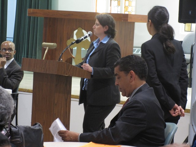 Brooke Davis, Assistant Attorney General in the Civil Rights Bureau, explained the details of the Vantage settlement. Espaillat reviews the settlement handout.