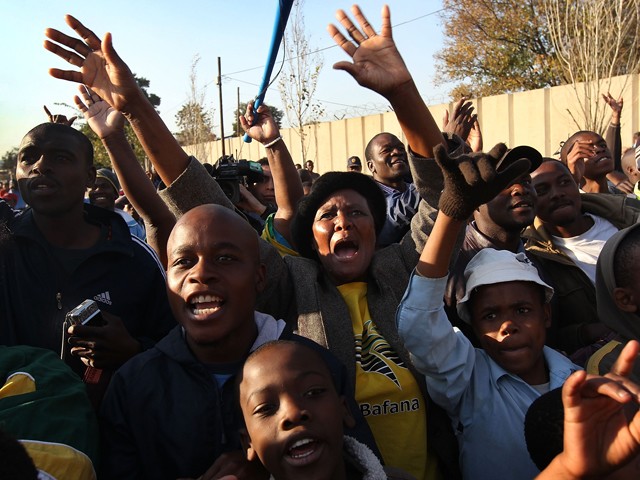 South African soccer fans cheer for the world’s top rated team, Brazil, on June 3, 2010. Thousands of local residents were given free tickets to watch Brazil practice.