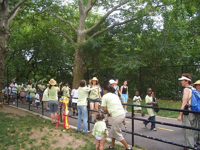 Crowd walks into Sunken Playground at Highbridge Park.