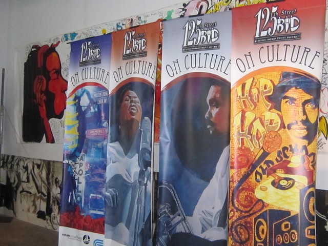 Four artistic lamppost banners celebrate harlem's music culture