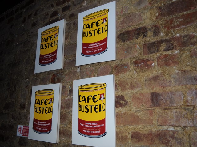 Perlata plays with other iconic items in his art, in this case arranging Cafe Bustelo cans in a style similar to Andy Warhol's Campbell's Tomato Soup  art.