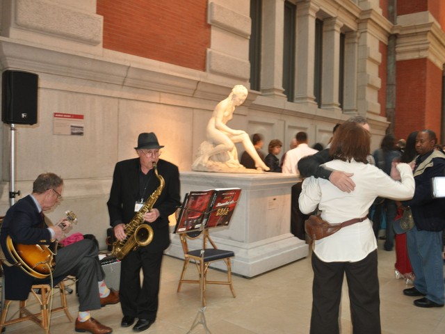Revelers danced at a cocktail party before entering the exhibition.