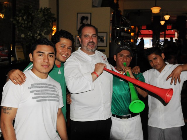 Kitchen Staff celebrates with head chef Pierre Landet.