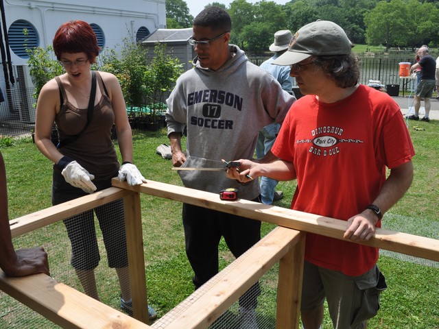 Katie Clifford, Adam Garrett-Clark and Vincent Marquardt help build compost bin.