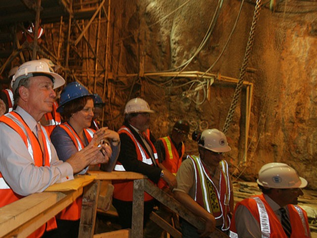 Mayor Bloomberg watches as the boring machine finishes the tunnel for the new 7 line.