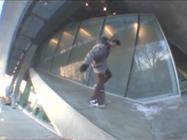 A skateboarder rides on the Cooper Union ramp.