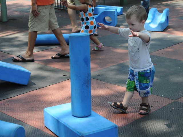 Owen Wells stacks pieces of the Imagination Plaground.