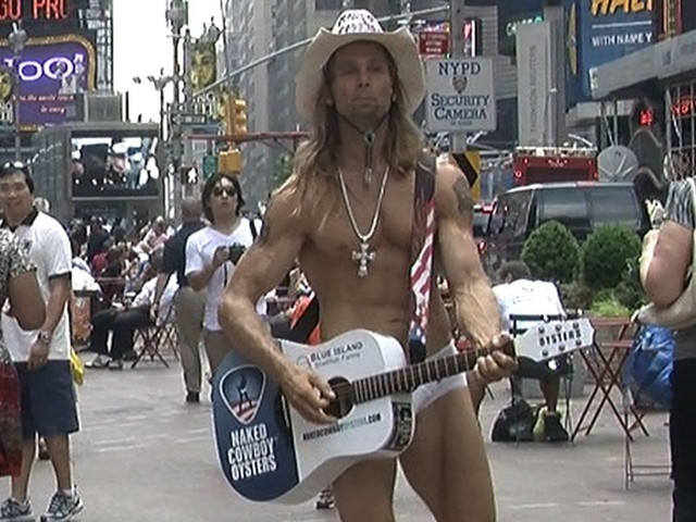 The Naked Cowboy returned to Times Square after his announcing his lawsuit against Sandy Kane.