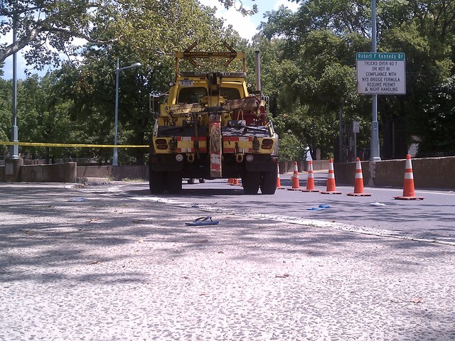 A pair of blue flip flops lay in the RFK bridge ramp behind the MTA truck that hit a 7-year-old boy July 30.