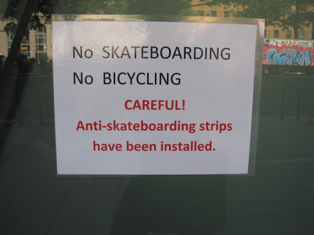 A sign warns skaters of the new strips.