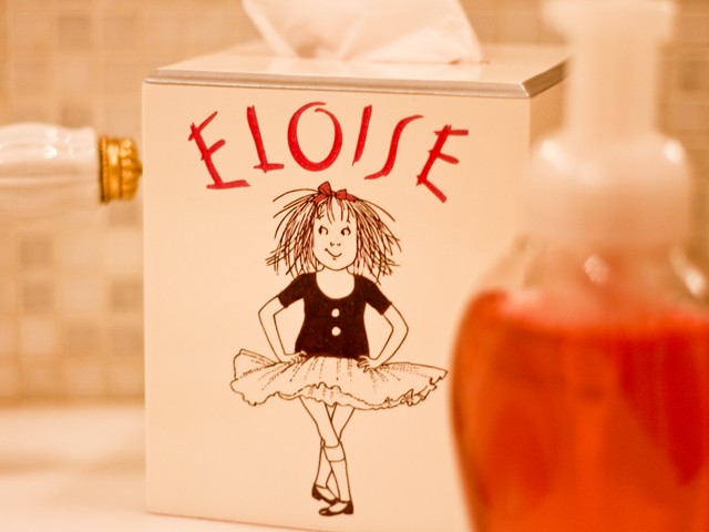 A tissue box sitting in the bathroom of the suite.